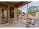 Covered patio with view of a backyard pool and firepit at 10542 E Skinner Dr, Scottsdale, AZ 85262