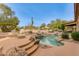 Inviting kidney-shaped pool with waterfall feature and flagstone deck at 10542 E Skinner Dr, Scottsdale, AZ 85262