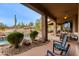 Expansive backyard with a glistening pool and patio furniture at 10542 E Skinner Dr, Scottsdale, AZ 85262