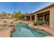 Resort-style pool with a relaxing waterfall and spacious patio at 10542 E Skinner Dr, Scottsdale, AZ 85262