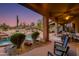 Expansive backyard oasis with a pool, spa, and desert landscaping at 10542 E Skinner Dr, Scottsdale, AZ 85262
