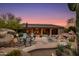 Relax by the pool and enjoy the expansive stone patio with outdoor furniture at 10542 E Skinner Dr, Scottsdale, AZ 85262