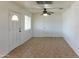 Bright living room with tile floors and ceiling fan at 1146 E 6Th St, Casa Grande, AZ 85122