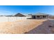 Large backyard with gravel and neighboring homes at 11980 S 173Rd Ave, Goodyear, AZ 85338