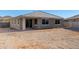 View of home's back elevation and backyard at 11980 S 173Rd Ave, Goodyear, AZ 85338