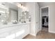 Double vanity bathroom with a large walk-in closet at 11980 S 173Rd Ave, Goodyear, AZ 85338