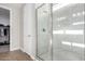 Modern bathroom with a walk-in shower and marble tile at 11980 S 173Rd Ave, Goodyear, AZ 85338