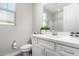 Clean bathroom with white vanity and quartz countertop at 11980 S 173Rd Ave, Goodyear, AZ 85338