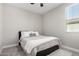 Cozy bedroom with a full-size bed and ceiling fan at 11980 S 173Rd Ave, Goodyear, AZ 85338