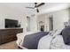 Bright bedroom with a dresser and a large window at 11980 S 173Rd Ave, Goodyear, AZ 85338