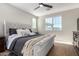Spacious bedroom with plush bed and large window at 11980 S 173Rd Ave, Goodyear, AZ 85338