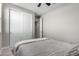 Simple bedroom with a double bed and white closet doors at 11980 S 173Rd Ave, Goodyear, AZ 85338