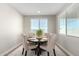 Elegant dining room with a round table and four upholstered chairs at 11980 S 173Rd Ave, Goodyear, AZ 85338