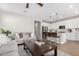 Open kitchen with white cabinets, an island, and stainless steel appliances at 11980 S 173Rd Ave, Goodyear, AZ 85338