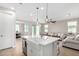 Open kitchen island with farmhouse sink and stainless steel appliances at 11980 S 173Rd Ave, Goodyear, AZ 85338