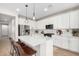 Modern kitchen with white cabinets, quartz countertops, and island at 11980 S 173Rd Ave, Goodyear, AZ 85338
