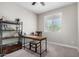 Home office with a desk, chair, and built-in shelving at 11980 S 173Rd Ave, Goodyear, AZ 85338