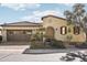 Front view of a single-story house with a tile roof and landscaping at 12671 W Dale Ln, Peoria, AZ 85383