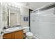 Bathroom with tub shower combo and wood vanity at 14444 W Moccasin Trl, Surprise, AZ 85374