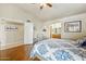 Bright bedroom with wood floors and access to a full bathroom at 14444 W Moccasin Trl, Surprise, AZ 85374