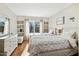 Guest bedroom with two twin beds and built-in shelving at 14444 W Moccasin Trl, Surprise, AZ 85374