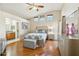 Spacious bedroom with wood floors and ensuite bathroom access at 14444 W Moccasin Trl, Surprise, AZ 85374