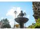 Community features an ornate fountain with palm trees in the background at 14444 W Moccasin Trl, Surprise, AZ 85374