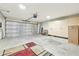Garage with storage cabinets and floor covering at 14444 W Moccasin Trl, Surprise, AZ 85374