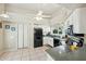 Well-equipped kitchen with white cabinets, black appliances, and granite counters at 14444 W Moccasin Trl, Surprise, AZ 85374