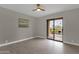 Bright bedroom with tile floors and sliding glass door at 14645 N Fountain Hills Blvd # 114, Fountain Hills, AZ 85268