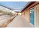 Back patio with covered shade structure and mountain views at 15612 S Tuthill Rd, Buckeye, AZ 85326