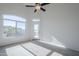 Bright bedroom with large window, private balcony access, and ceiling fan at 1747 E Northern Ave # 218, Phoenix, AZ 85020