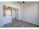 Living room with wood-look floors and access to kitchen at 1747 E Northern Ave # 218, Phoenix, AZ 85020