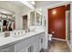Double vanity bathroom with a walk-in shower and an accent wall at 17850 N 68Th St # 3027, Phoenix, AZ 85054