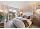 Bright bedroom with a king-size bed and private balcony access at 17850 N 68Th St # 3027, Phoenix, AZ 85054