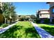 Landscaped courtyard with walking paths and green grass at 17850 N 68Th St # 3027, Phoenix, AZ 85054