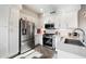 Modern kitchen featuring stainless steel appliances and white cabinetry at 17850 N 68Th St # 3027, Phoenix, AZ 85054