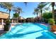Community pool with palm trees and lounge chairs at 17850 N 68Th St # 3027, Phoenix, AZ 85054