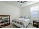 Bedroom with full-size bed, nightstand, and ceiling fan at 1792 W Loemann Dr, San Tan Valley, AZ 85144