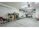 Spacious garage with overhead storage and ample room for vehicles and tools at 1792 W Loemann Dr, San Tan Valley, AZ 85144