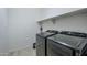 Laundry room with washer and dryer, and extra shelving at 1792 W Loemann Dr, San Tan Valley, AZ 85144
