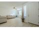 Living room with light walls, wood-look floors, and neutral furniture at 1792 W Loemann Dr, San Tan Valley, AZ 85144