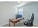 Home office with a desk, two monitors, and comfortable chair at 1792 W Loemann Dr, San Tan Valley, AZ 85144