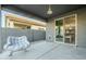 Covered patio with rocking chair and view of backyard at 1792 W Loemann Dr, San Tan Valley, AZ 85144