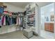 Large walk-in closet with ample shelving and hanging space at 1792 W Loemann Dr, San Tan Valley, AZ 85144