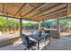 Outdoor patio with seating area, string lights, and a built-in grill at 20219 N 10Th Ave, Phoenix, AZ 85027