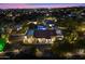 Night view of home, beautifully lit, showcasing curb appeal at 24218 N 85Th St, Scottsdale, AZ 85255