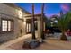 Evening view of backyard patio with pergola, seating area, and hot tub at 24218 N 85Th St, Scottsdale, AZ 85255