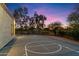 Well-lit outdoor basketball court at dusk at 24218 N 85Th St, Scottsdale, AZ 85255