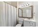 Clean bathroom with a single sink vanity and shower/tub combo at 24218 N 85Th St, Scottsdale, AZ 85255